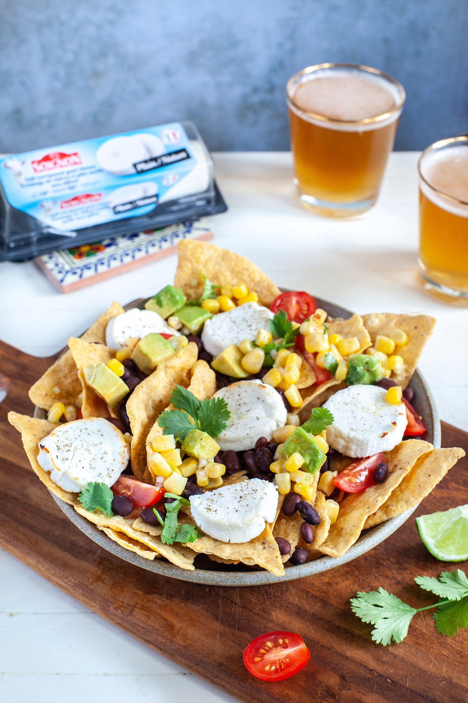 Nachos with cheddar, Soignon goat cheese and corn and avocado salsa